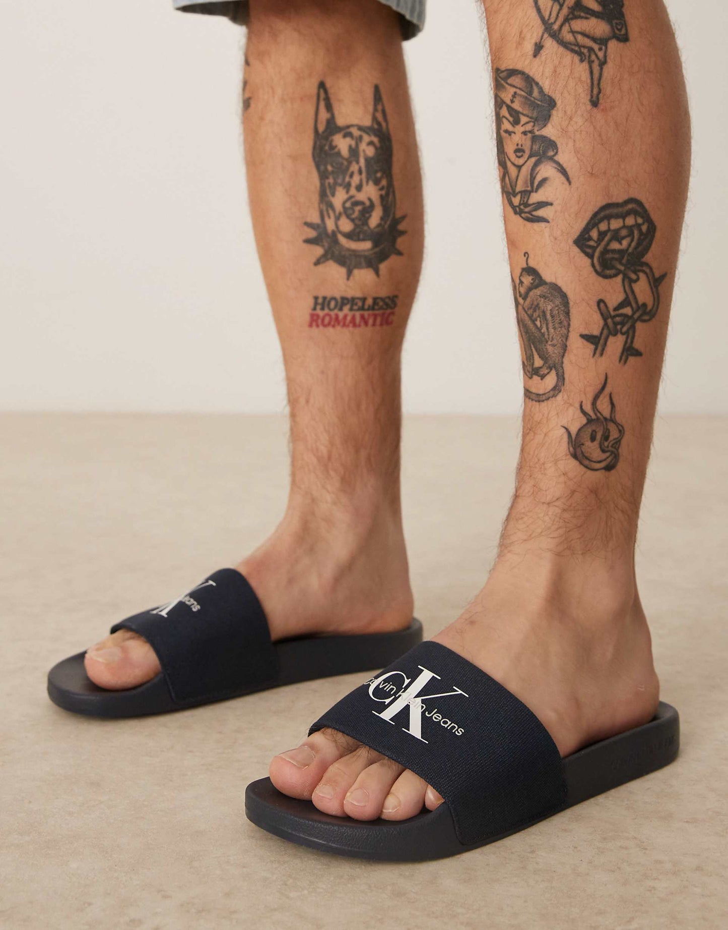 Calvin Klein Jeans large logo sliders in navy