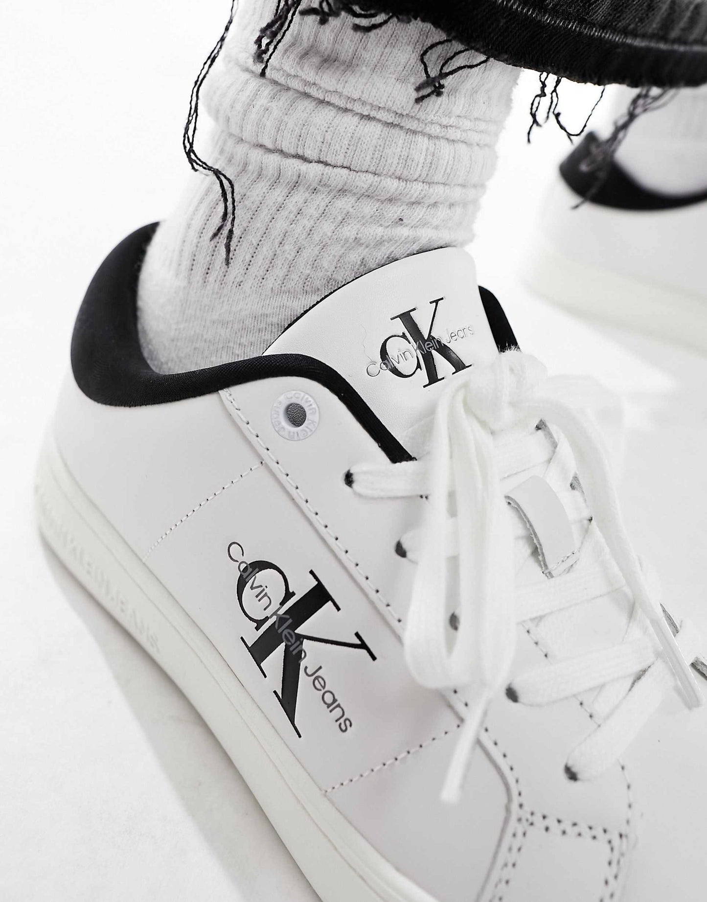 Calvin Klein leather trainers in white & black