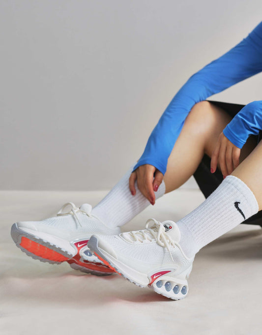 Nike Air Max DN trainers in white and purple